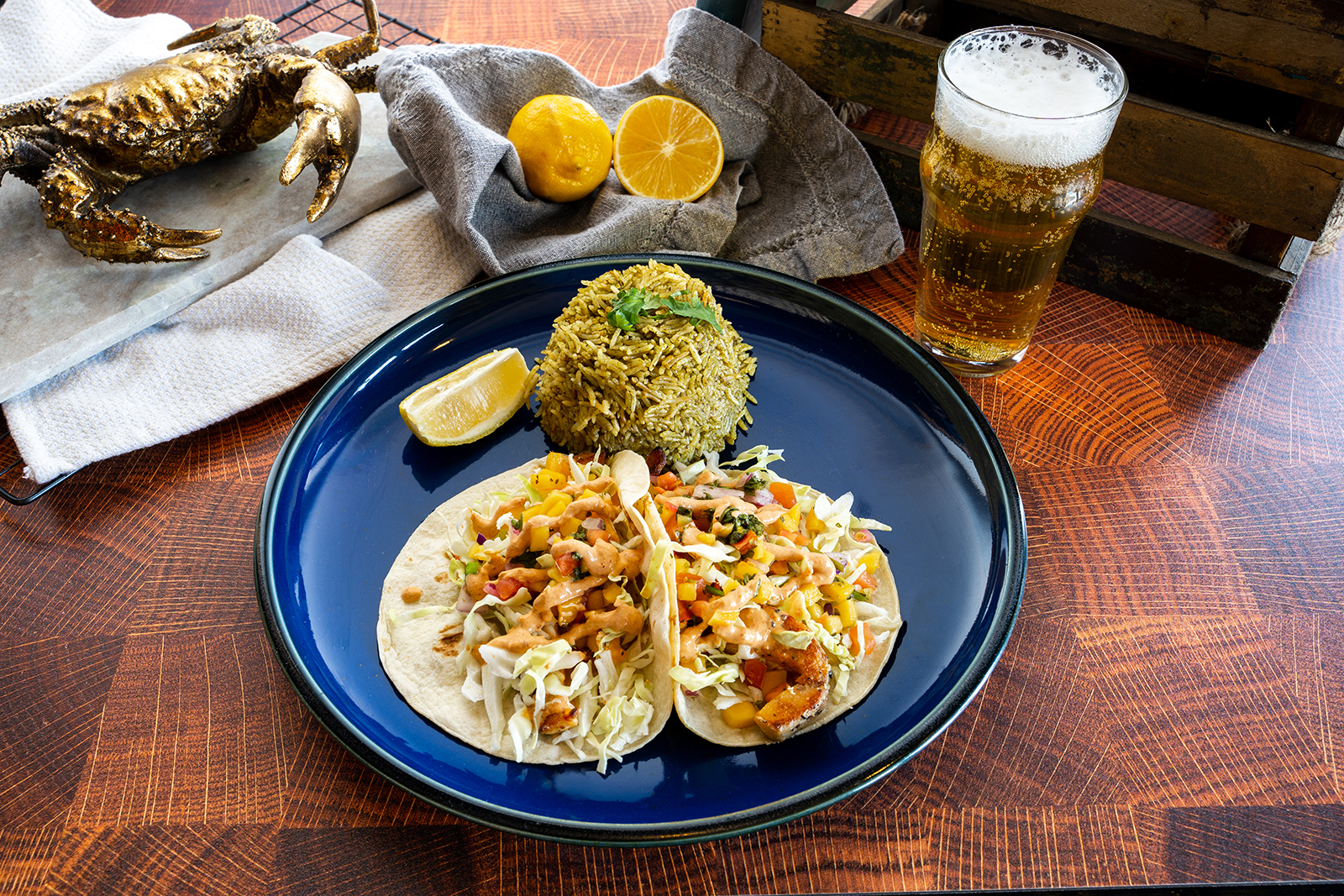 Williams Family Fish tacos served with cilantro rice, lemon, and a cold drink